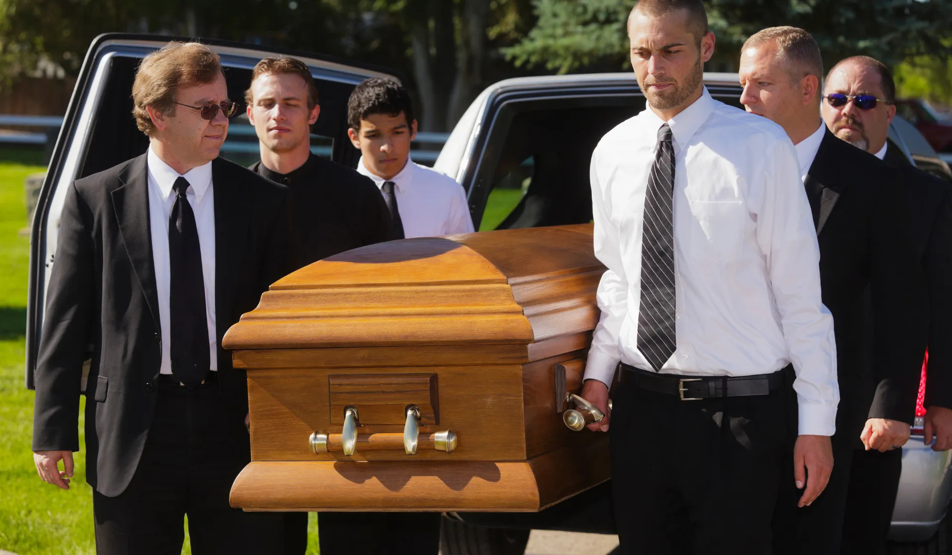 LeadGulls funeral home PPC specialists reviewing Google Ads and Facebook campaign inquiry data for a funeral service provider showing at-need call volume and pre-planning registration metrics